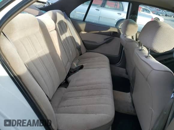 1995 Toyota Camry DX z VIN 4T1SK11E7SU597237, wystawiony jako Copart lot #43271845 z przebiegiem 237 581 mil mil oraz Szkoda całkowita • Salvage title. Historia ofert i sprzedaży dostępna na DreamBid. Obrazek 10.