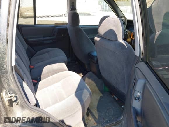 1996 Jeep Grand Cherokee Laredo z VIN 1J4GZ58SXTC280868, wystawiony jako IAAI lot #42653608 z przebiegiem 188 867 mil mil oraz . Historia ofert i sprzedaży dostępna na DreamBid. Obrazek 8.