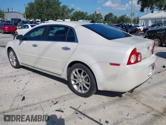 2012 Chevrolet Malibu LTZ z VIN 1G1ZG5E75CF156969, wystawiony jako IAAI lot #42576487 z przebiegiem 107 729 mil mil oraz . Historia ofert i sprzedaży dostępna na DreamBid. Obrazek 3.