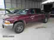 2001 Dodge Dakota Sport z VIN 1B7GG2AN21S104169, wystawiony jako Copart lot #67199295 z przebiegiem 233 541 mil mil oraz Szkoda całkowita • Salvage title. Historia ofert i sprzedaży dostępna na DreamBid. Obrazek 1.