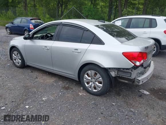 2015 Chevrolet Cruze LS with VIN 1G1PB5SG3F7250969, listed as a IAAI auction lot 42502563 with 90,337 mi miles and . Bid and sale history available at DreamBid. Image 3.