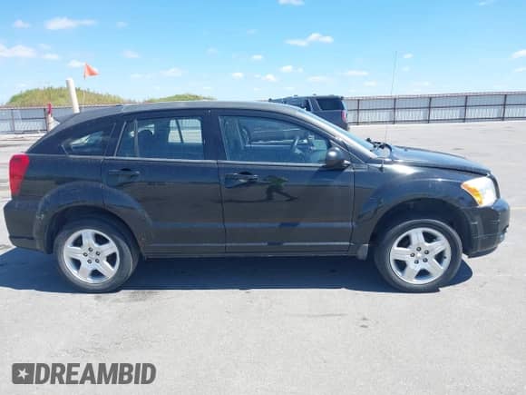 2009 Dodge Caliber SXT with VIN 1B3HB48A59D183646, listed as a IAAI auction lot 43048308 with 152,808 mi miles and . Bid and sale history available at DreamBid. Image 14.