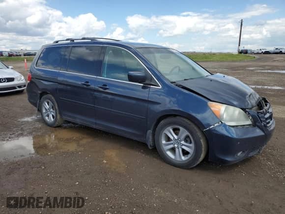 2010 Honda Odyssey with VIN 5FNRL3H81AB507082, listed as a Copart auction lot 62931535 with 328,109 mi miles and Salvage title. Bid and sale history available at DreamBid. Image 4.