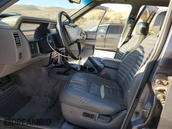 1994 Jeep Grand Cherokee Laredo with VIN 1J4GZ58Y6RC275647, listed as a Copart auction lot 81818255 with 147,486 mi miles and Salvage title. Bid and sale history available at DreamBid. Image 7.