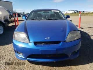 2006 Hyundai Tiburon SE с VIN KMHHN65D06U230928, выставлен на аукционе Copart как лот 72745854 с пробегом 246 837 миль миль и Чистый • Clean title. История ставок и продаж доступна на DreamBid. Изображение 5.