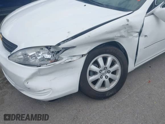 2002 Toyota Camry LE z VIN 4T1BE32K52U111483, wystawiony jako IAAI lot #43065186 z przebiegiem 64 862 mil mil oraz . Historia ofert i sprzedaży dostępna na DreamBid. Obrazek 6.