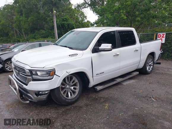 2021 Ram 1500 Laramie with VIN 1C6RREJT5MN628655, listed as a IAAI auction lot 42734346 with 104,116 mi miles and . Bid and sale history available at DreamBid. Image 2.