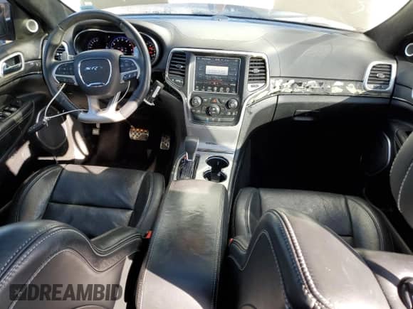 2016 Jeep Grand Cherokee SRT с VIN 1C4RJFDJXGC486674, выставлен на аукционе Copart как лот 49088325 с пробегом 63 701 миль миль и Списание • Salvage title. История ставок и продаж доступна на DreamBid. Изображение 8.