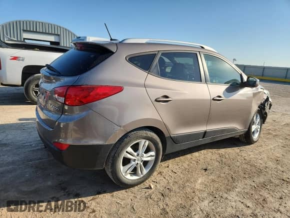 2013 Hyundai Tucson Limited z VIN KM8JU3ACXDU598031, wystawiony jako Copart lot #81800385 z przebiegiem 137 397 mil mil oraz Szkoda całkowita • Salvage title. Historia ofert i sprzedaży dostępna na DreamBid. Obrazek 3.