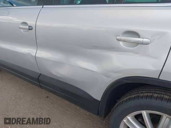 2011 Volkswagen Tiguan S with VIN WVGBV7AXXBW560022, listed as a IAAI auction lot 42693212 with 127,879 mi miles and . Bid and sale history available at DreamBid. Image 6.