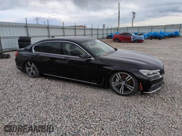 2017 BMW 7 Series 750i with VIN WBA7F0C35HGM21697, listed as a Copart auction lot 54713825 with Not provided miles and Salvage title. Bid and sale history available at DreamBid. Image 4.