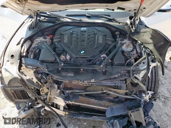 2015 BMW 7 Series 750i с VIN WBAYA8C51FG197604, выставлен на аукционе Copart как лот 71919285 с пробегом 165 914 миль миль и Списание • Salvage title. История ставок и продаж доступна на DreamBid. Изображение 11.