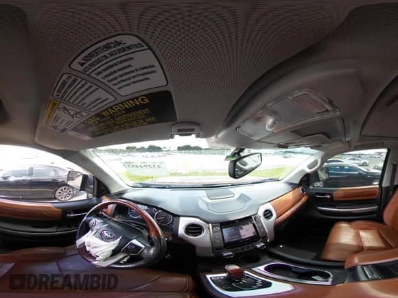 2014 Toyota Tundra 1794 Edition with VIN 5TFGY5F13EX165687, listed as a IAAI auction lot 43294453 with 126,120 mi miles and . Bid and sale history available at DreamBid. Image 18.