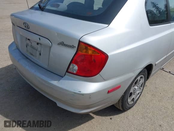 2005 Hyundai Accent GLS z VIN KMHCG35C65U332999, wystawiony jako IAAI lot #42097932 z przebiegiem 225 593 mil mil oraz . Historia ofert i sprzedaży dostępna na DreamBid. Obrazek 6.