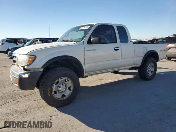1998 Toyota Tacoma with VIN 4TASM92N1WZ175674, listed as a Copart auction lot 89734125 with 214,966 mi miles and Salvage title. Bid and sale history available at DreamBid. Image 1.
