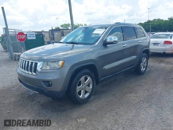 2012 Jeep Grand Cherokee Limited z VIN 1C4RJEBGXCC290696, wystawiony jako IAAI lot #42753634 z przebiegiem 205 808 mil mil oraz . Historia ofert i sprzedaży dostępna na DreamBid. Obrazek 17.