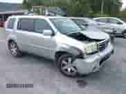 2014 Honda Pilot Touring with VIN 5FNYF4H97EB051760, listed as a IAAI auction lot 43329833 with 220,273 mi miles and . Bid and sale history available at DreamBid. Image 1.