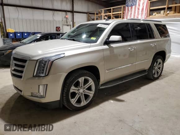 2015 Cadillac Escalade z VIN 1GYS4AKJ1FR100437, wystawiony jako Copart lot #44642635 z przebiegiem 51 581 mil mil oraz Czysty tytuł • Clean title. Historia ofert i sprzedaży dostępna na DreamBid. Obrazek 1.