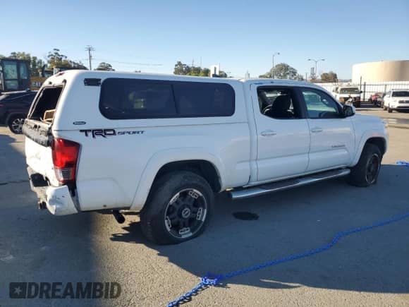 2016 Toyota Tacoma TRD Sport with VIN 3TMBZ5DN9GM001172, listed as a Copart auction lot 86475475 with 92,598 mi miles and Salvage title. Bid and sale history available at DreamBid. Image 3.