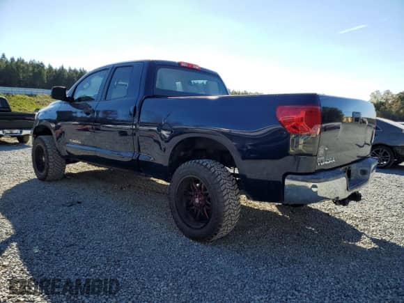 2013 Toyota Tundra with VIN 5TFRM5F13DX059694, listed as a Copart auction lot 82513565 with 122,344 mi miles and Salvage title. Bid and sale history available at DreamBid. Image 2.
