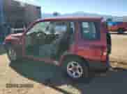 1999 Chevrolet Tracker z VIN 2CNBJ13C2X6911316, wystawiony jako Copart lot #74851094 z przebiegiem Nie podano mil oraz Szkoda całkowita • Salvage title. Historia ofert i sprzedaży dostępna na DreamBid. Obrazek 2.