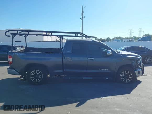 2014 Toyota Tundra SR z VIN 5TFRM5F10EX080231, wystawiony jako IAAI lot #43477473 z przebiegiem 202 585 mil mil oraz . Historia ofert i sprzedaży dostępna na DreamBid. Obrazek 13.