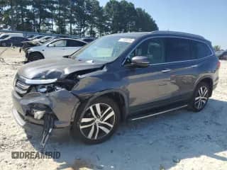 2018 Honda Pilot Elite с VIN 5FNYF6H0XJB055566, выставлен на аукционе Copart как лот 71006755 с пробегом 83 177 миль миль и Списание • Salvage title. История ставок и продаж доступна на DreamBid. Изображение 1.