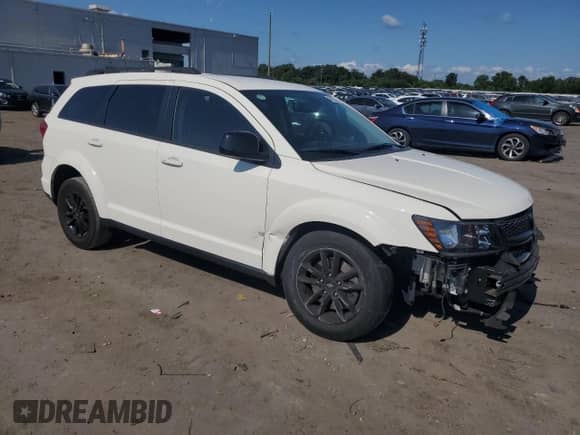 2019 Dodge Journey SE with VIN 3C4PDCBB8KT833943, listed as a Copart auction lot 68223735 with 144,158 mi miles and Salvage title. Bid and sale history available at DreamBid. Image 4.