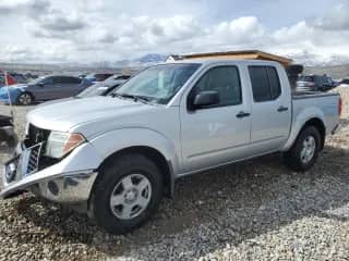 2005 Nissan Frontier SE with VIN 1N6AD07W95C455998, listed as a Copart auction lot 51514145 with 135,000 mi miles and Salvage title. Bid and sale history available at DreamBid. Image 1.