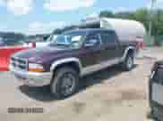 2004 Dodge Dakota SLT with VIN 1D7HG48NX4S649522, listed as a IAAI auction lot 42580132 with 124,037 mi miles and . Bid and sale history available at DreamBid. Image 2.