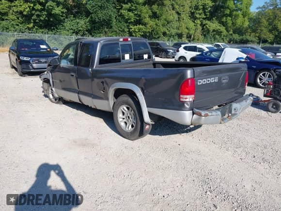 2002 Dodge Dakota SLT with VIN 1B7GL42X92S512287, listed as a IAAI auction lot 43082241 with 151,099 mi miles and . Bid and sale history available at DreamBid. Image 3.