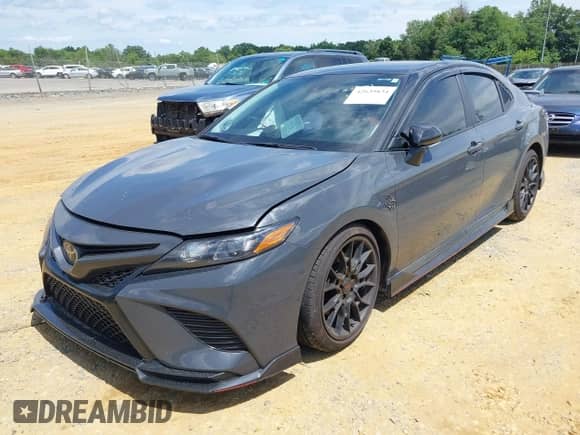 2024 Toyota Camry TRD with VIN 4T1KZ1AK6RU104093, listed as a IAAI auction lot 42639834 with 7,454 mi miles and . Bid and sale history available at DreamBid. Image 2.