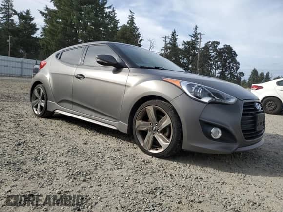 2015 Hyundai Veloster Turbo z VIN KMHTC6AEXFU237769, wystawiony jako Copart lot #84004975 z przebiegiem 98 923 mil mil oraz Czysty tytuł • Clean title. Historia ofert i sprzedaży dostępna na DreamBid. Obrazek 4.