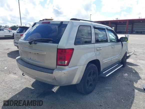 2006 Jeep Grand Cherokee Laredo z VIN 1J4GR48K26C323811, wystawiony jako IAAI lot #43477028 z przebiegiem 79 760 mil mil oraz . Historia ofert i sprzedaży dostępna na DreamBid. Obrazek 4.