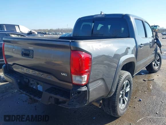 2017 Toyota Tacoma TRD Off Road with VIN 5TFAZ5CN2HX027623, listed as a IAAI auction lot 41731461 with 103,232 mi miles and . Bid and sale history available at DreamBid. Image 4.