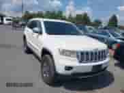 2012 Jeep Grand Cherokee Overland z VIN 1C4RJFCT1CC171419, wystawiony jako IAAI lot #42824161 z przebiegiem 172 345 mil mil oraz . Historia ofert i sprzedaży dostępna na DreamBid. Obrazek 1.