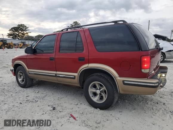 1999 Chevrolet Blazer LS с VIN 1GNCS13WXX2126904, выставлен на аукционе Copart как лот 69987244 с пробегом 384 028 миль миль и Списание • Salvage title. История ставок и продаж доступна на DreamBid. Изображение 2.