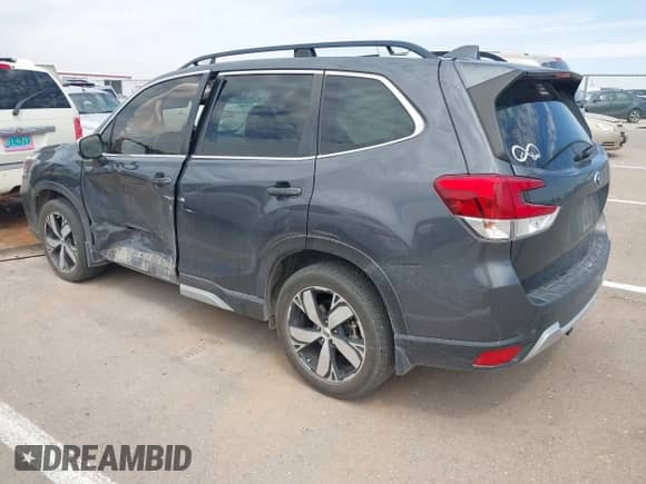 2020 Subaru Forester Touring with VIN JF2SKAXCXLH603473, listed as a IAAI auction lot 43136578 with 61,456 mi miles and . Bid and sale history available at DreamBid. Image 3.