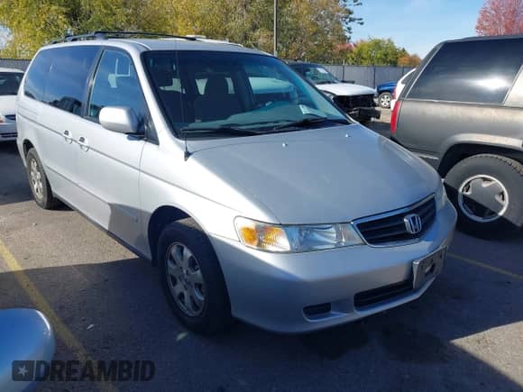 2002 Honda Odyssey EX z VIN 2HKRL18632H555706, wystawiony jako IAAI lot #43552585 z przebiegiem 183 324 mil mil oraz . Historia ofert i sprzedaży dostępna na DreamBid. Obrazek 1.
