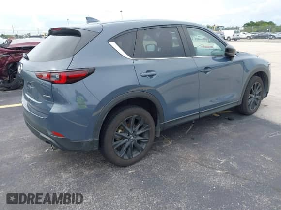 2023 Mazda CX-5 S Carbon Edition z VIN JM3KFBCM1P0132803, wystawiony jako IAAI lot #43128566 z przebiegiem 37 967 mil mil oraz . Historia ofert i sprzedaży dostępna na DreamBid. Obrazek 4.
