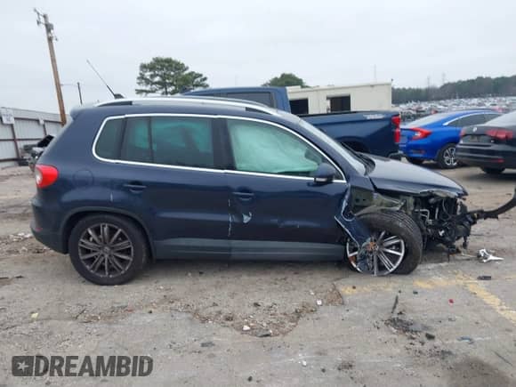 2011 Volkswagen Tiguan S with VIN WVGAV7AX7BW527670, listed as a IAAI auction lot 41189707 with 155,282 mi miles and . Bid and sale history available at DreamBid. Image 12.