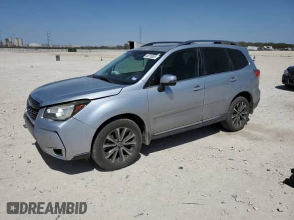 2017 Subaru Forester Touring z VIN JF2SJGWC2HH431342, wystawiony jako Copart lot #50216305 z przebiegiem 123 995 mil mil oraz Szkoda całkowita • Salvage title. Historia ofert i sprzedaży dostępna na DreamBid. Obrazek 1.