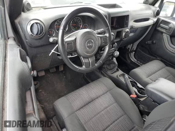 2012 Jeep Wrangler Sport z VIN 1C4AJWAG6CL228765, wystawiony jako Copart lot #80979855 z przebiegiem 216 434 mil mil oraz Szkoda całkowita • Salvage title. Historia ofert i sprzedaży dostępna na DreamBid. Obrazek 8.