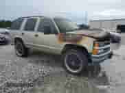 1999 Chevrolet Tahoe with VIN 1GNEC13R0XJ497169, listed as a Copart auction lot 64931085 with Not provided miles and Salvage title. Bid and sale history available at DreamBid. Image 4.