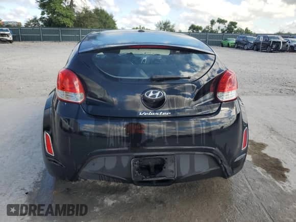 2015 Hyundai Veloster z VIN KMHTC6AD0FU237545, wystawiony jako Copart lot #69858765 z przebiegiem 182 058 mil mil oraz Szkoda całkowita • Salvage title. Historia ofert i sprzedaży dostępna na DreamBid. Obrazek 6.