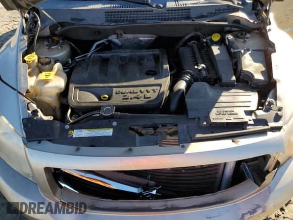 2010 Dodge Caliber Uptown z VIN 1B3CB9HB8AD611181, wystawiony jako Copart lot #86784104 z przebiegiem 119 103 mil mil oraz Szkoda całkowita • Salvage title. Historia ofert i sprzedaży dostępna na DreamBid. Obrazek 12.