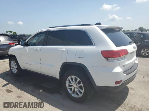 2014 Jeep Grand Cherokee Laredo with VIN 1C4RJEAGXEC157778, listed as a Copart auction lot 65999535 with 124,804 mi miles and Salvage title. Bid and sale history available at DreamBid. Image 2.