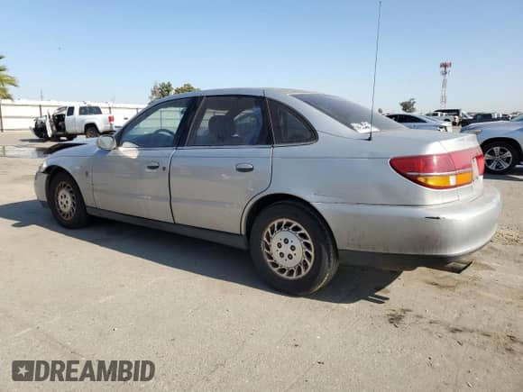 2000 Saturn LS with VIN 1G8JW52R0YY636923, listed as a Copart auction lot 62186235 with 335,017 mi miles and Salvage title. Bid and sale history available at DreamBid. Image 2.