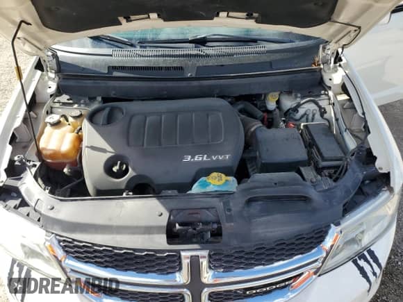 2013 Dodge Journey SXT z VIN 3C4PDCBG4DT649811, wystawiony jako Copart lot #71293785 z przebiegiem 178 086 mil mil oraz Szkoda całkowita • Salvage title. Historia ofert i sprzedaży dostępna na DreamBid. Obrazek 12.