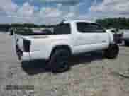 2018 Toyota Tacoma SR with VIN 5TFCZ5ANXJX162902, listed as a Copart auction lot 68464895 with 105,750 mi miles and Salvage title. Bid and sale history available at DreamBid. Image 3.